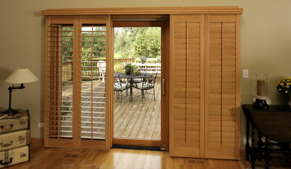 Bypass wood patio door shutters in Orlando living room
